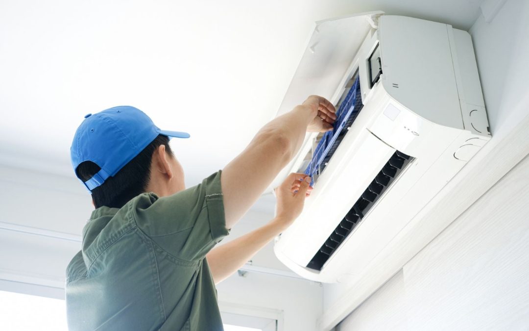 HVAC technician servicing a ductless mini split in San Gabriel