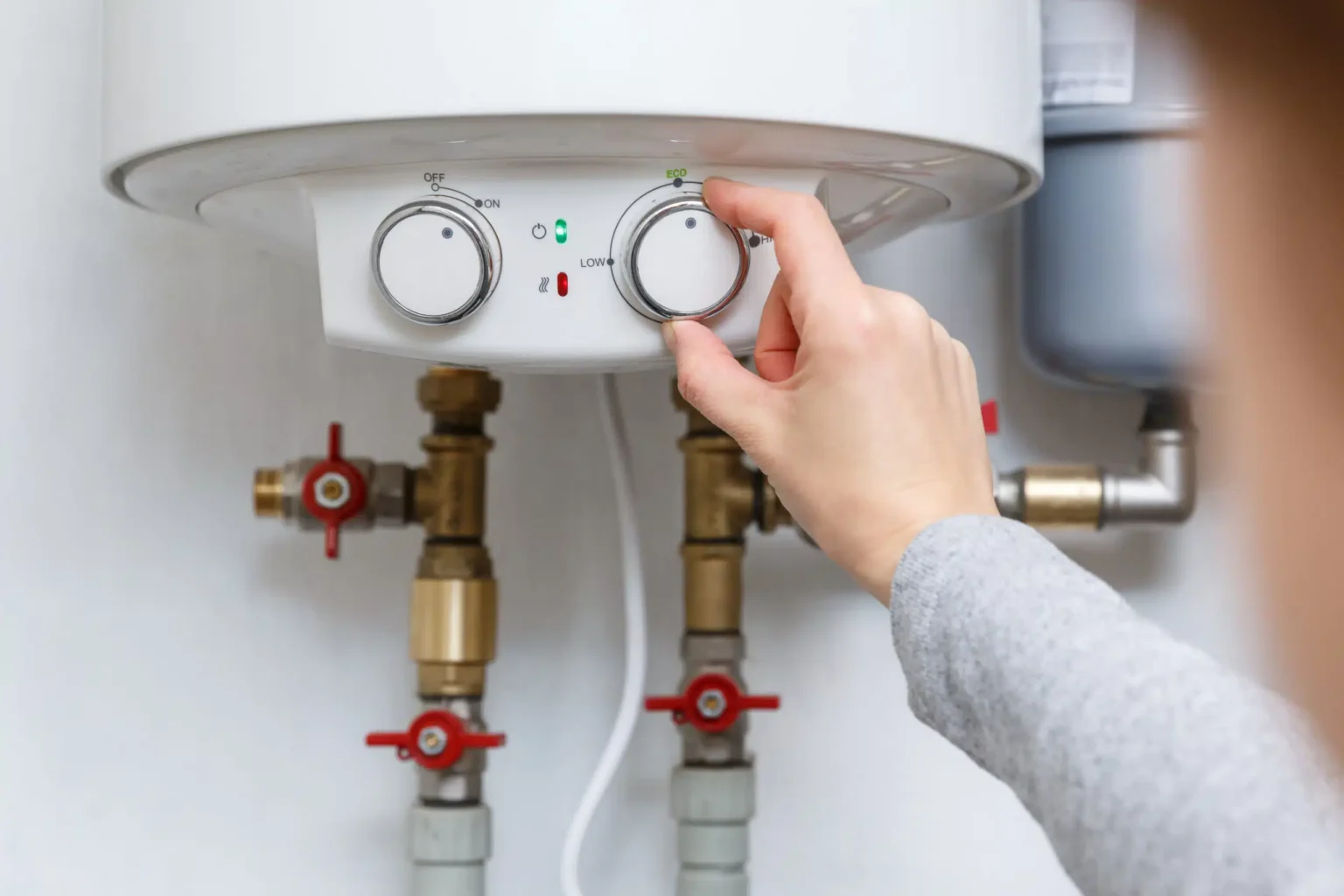 Technician adjusting a water heater in San Gabriel